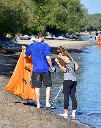 Start your volunteer application today to take part in park clean ups at Durand Eastman Beach